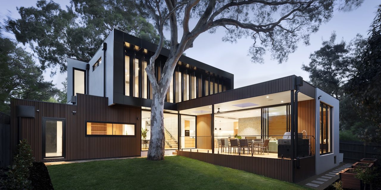 A home at dusk with the lights on